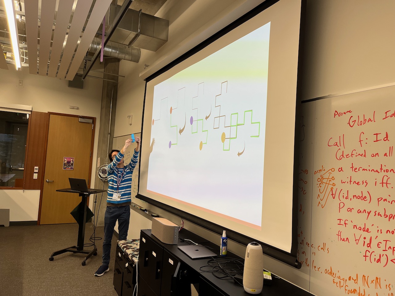 A picture of Oliver teaching the students how to make a dragon curve