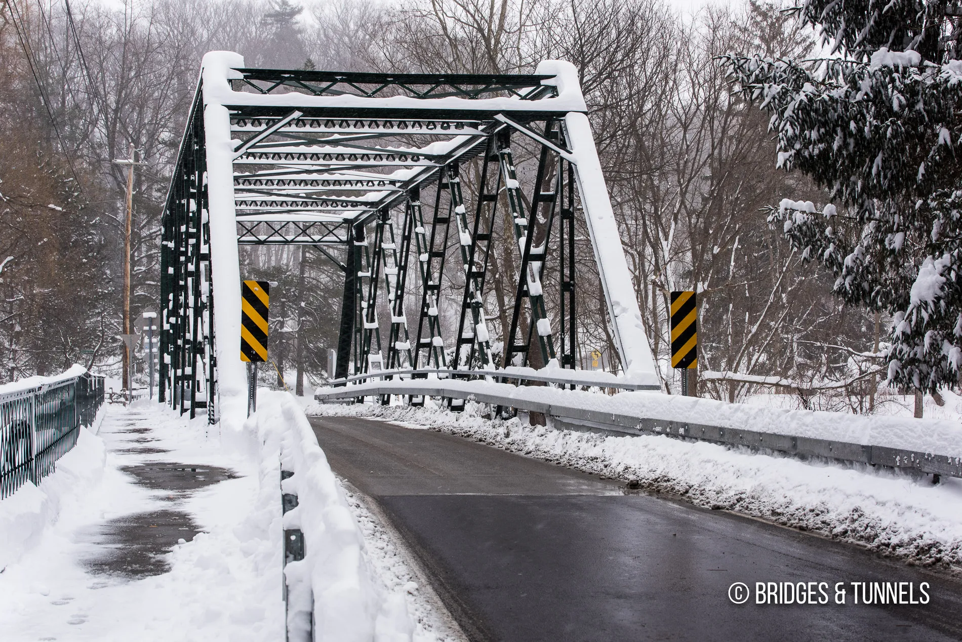One-lane bridge covered in snow